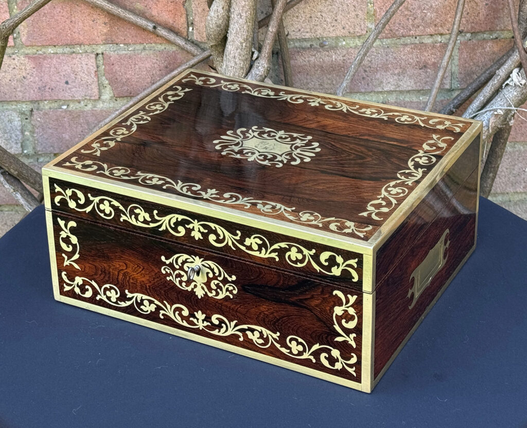 Front right view of an Antique Jewellery Box in Rosewood with Scrollwork Brass Inlay.