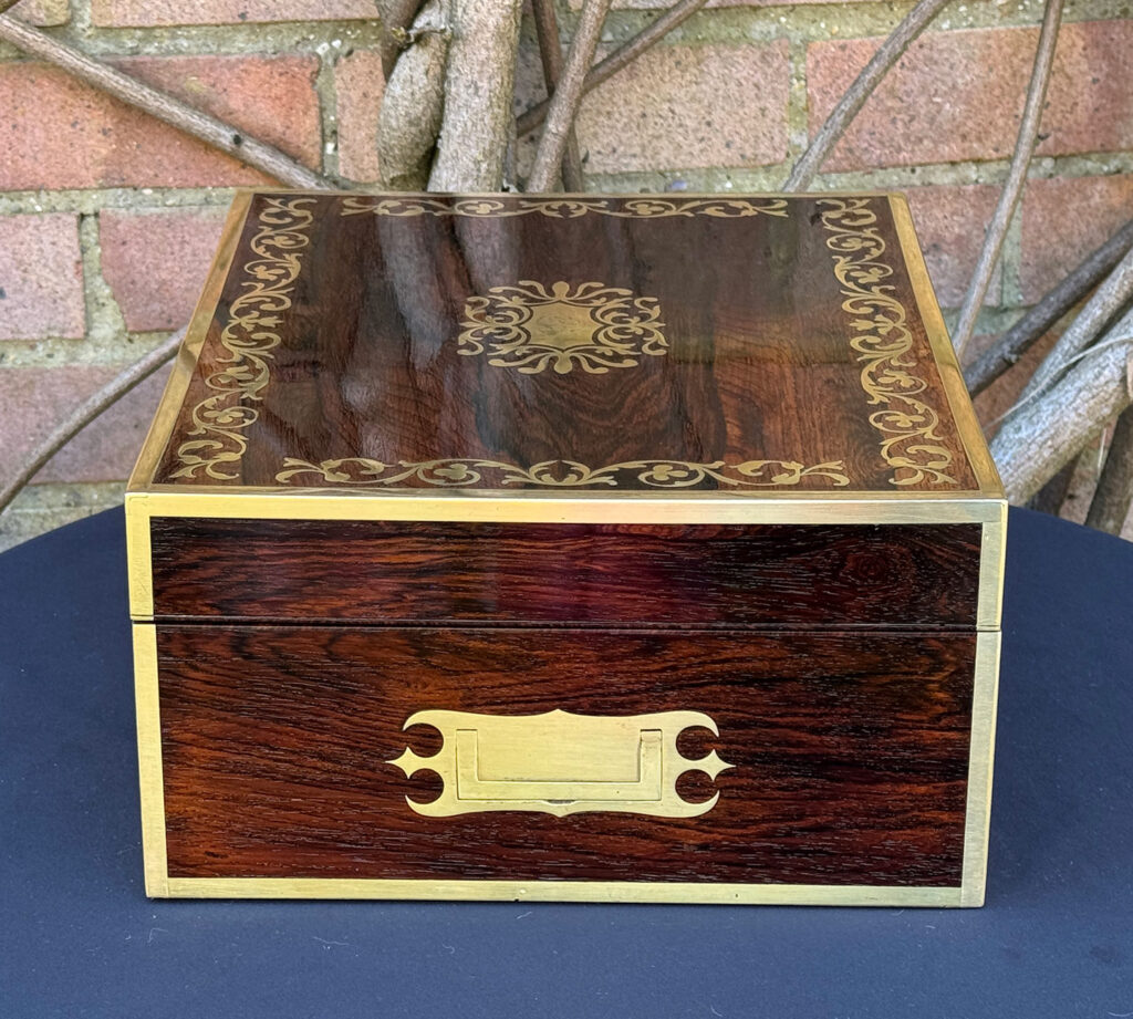 Left side view of an Antique Jewellery Box in Rosewood with Scrollwork Brass Inlay.