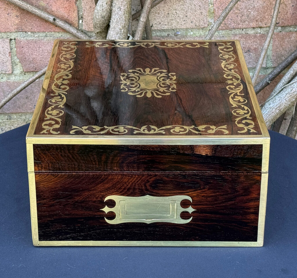 Right side view of an Antique Jewellery Box in Rosewood with Scrollwork Brass Inlay.