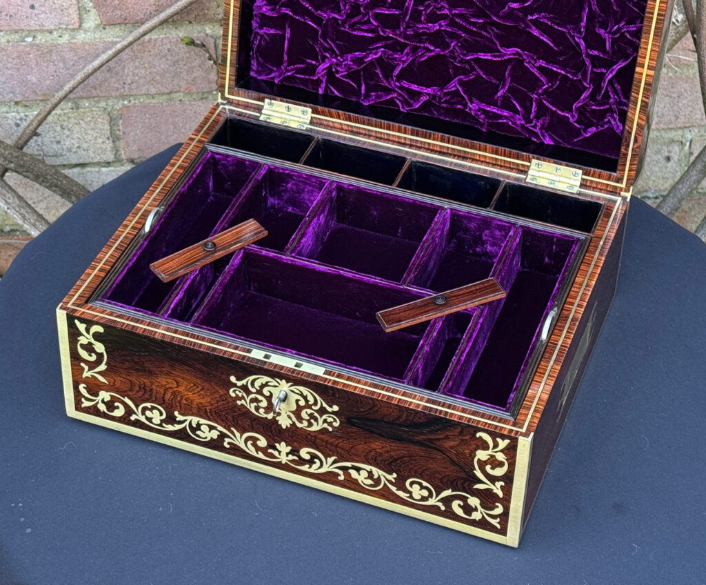 Front internal view of an Antique Jewellery Box in Rosewood with Scrollwork Brass Inlay with internal lids removed.