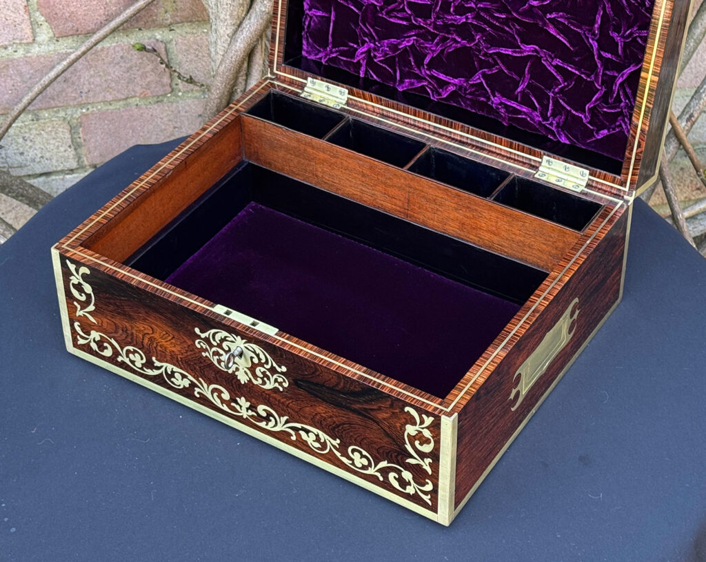 Overhead internal view of an Antique Jewellery Box in Rosewood with Scrollwork Brass Inlay with tray removed.