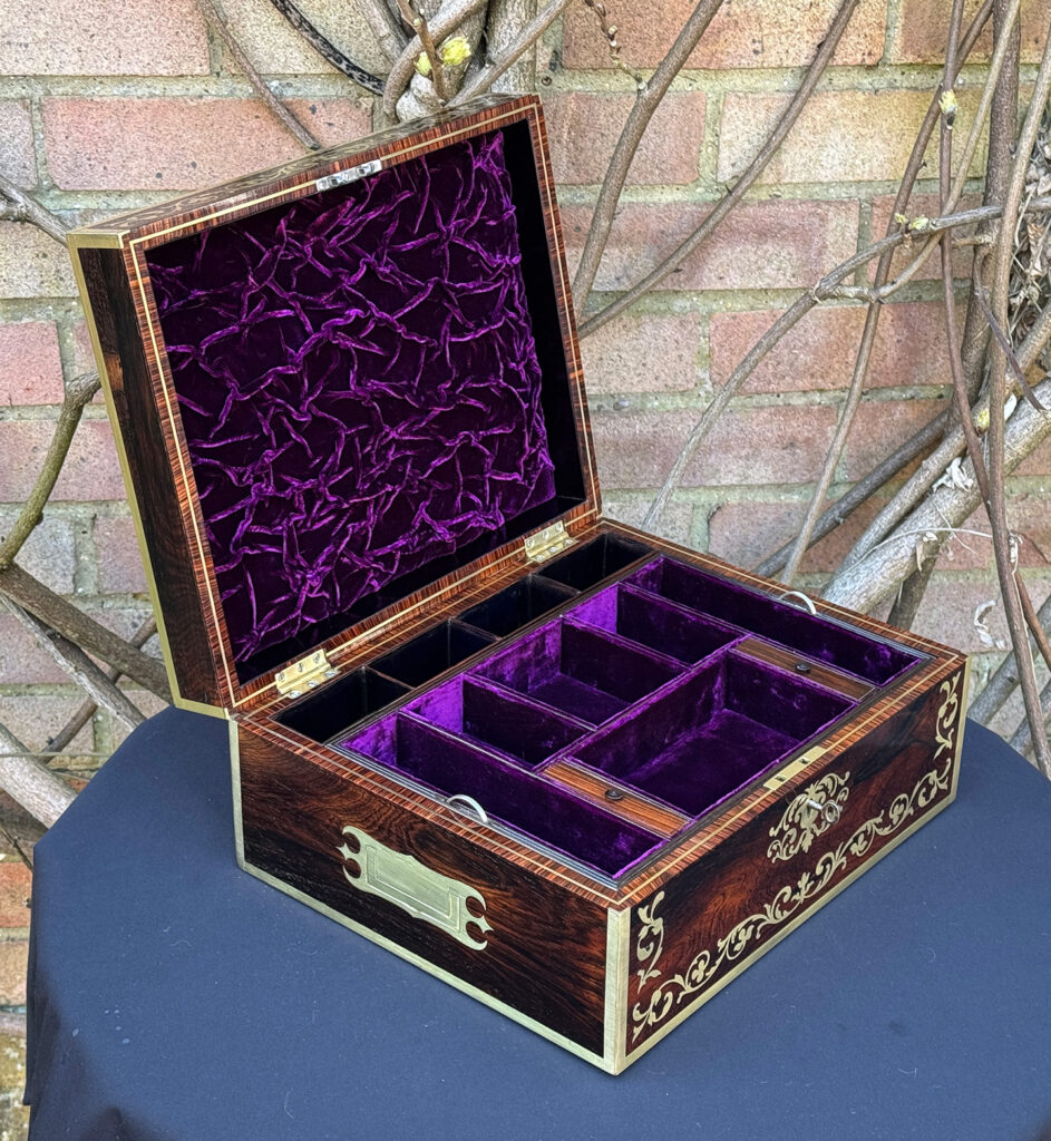 Left side internal view of an Antique Jewellery Box in Rosewood with Scrollwork Brass Inlay.