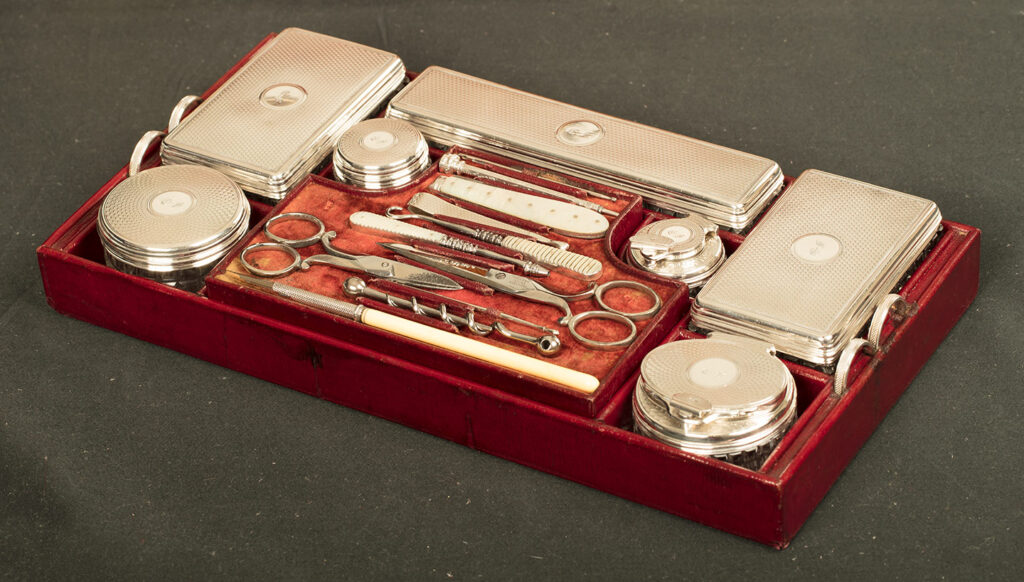 Top tray containing silver mounted jars from an Antique Silver Mounted Dressing Case in Rosewood, by David Edwards.