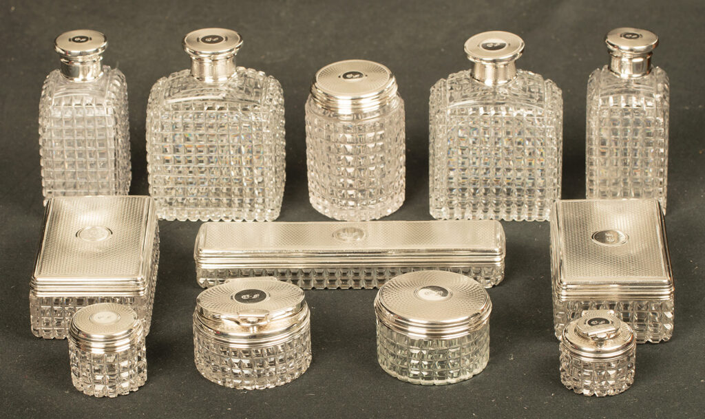 Silver mounted bottles and jars from an Antique Silver Mounted Dressing Case in Rosewood, by David Edwards.