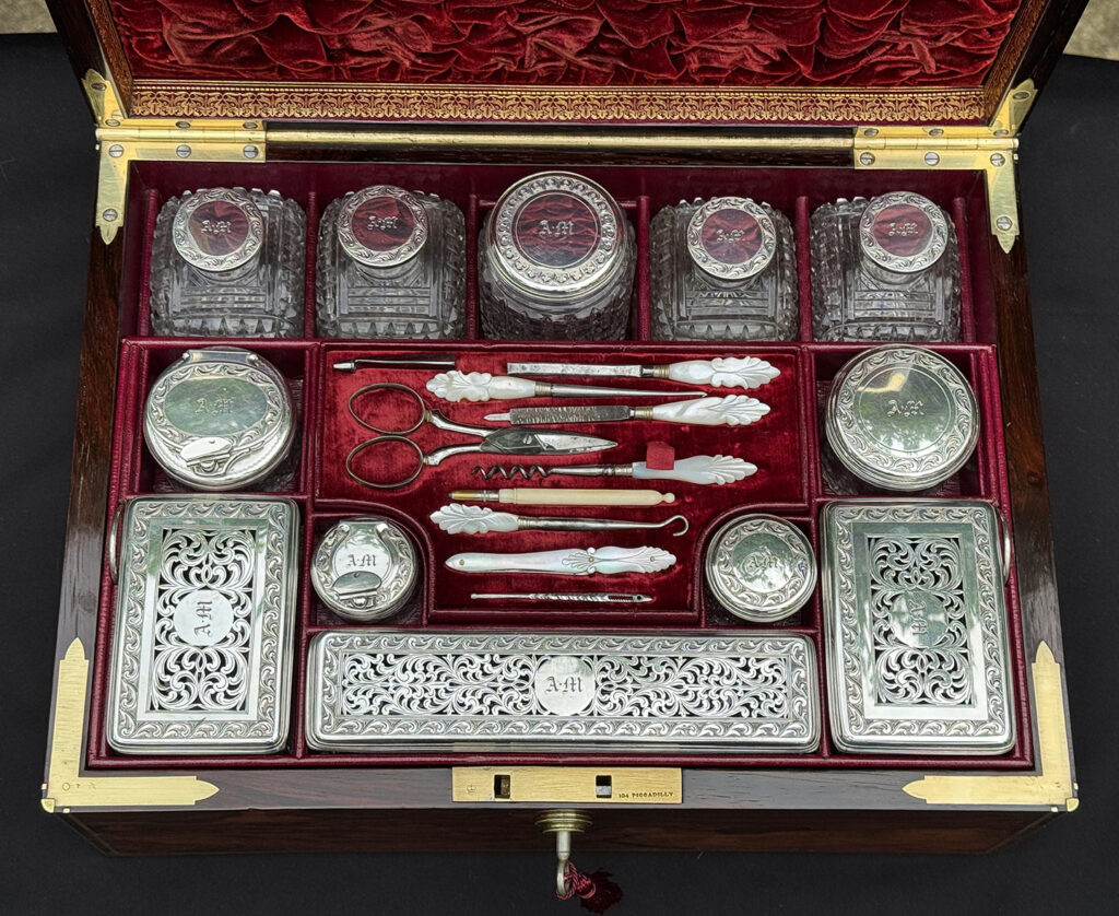 Overhead internal view of the bottles and jars from an Antique Dressing Case in Rosewood by David Edwards.