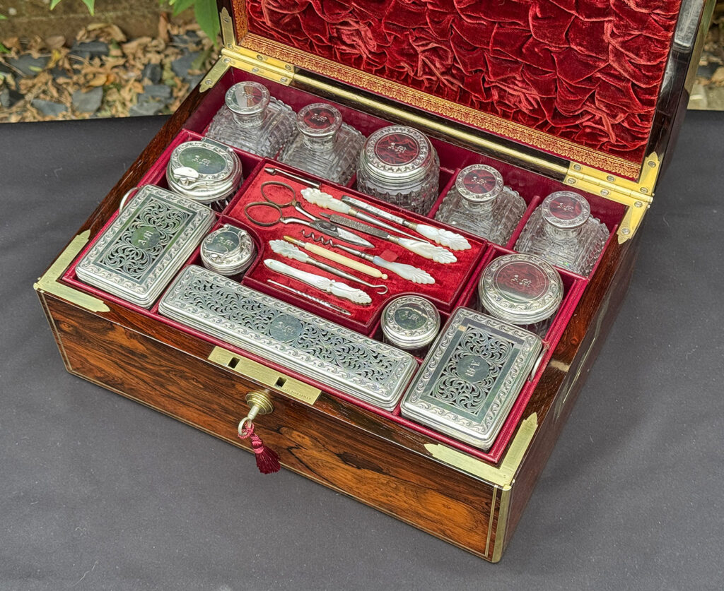Overhead internal view of the silver contents from an Antique Dressing Case in Rosewood by David Edwards.