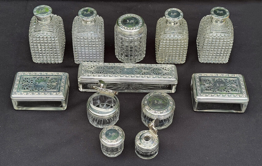 Overhead view of the glass bottles from an Antique Dressing Case in Rosewood by David Edwards.