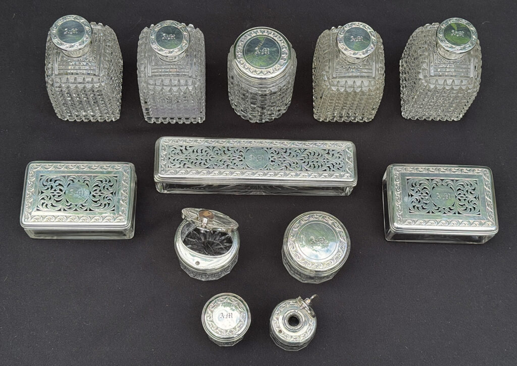 Overhead view of the glass bottles from an Antique Dressing Case in Rosewood by David Edwards.