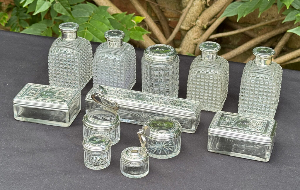 Front right view of the glass bottles from an Antique Dressing Case in Rosewood by David Edwards.