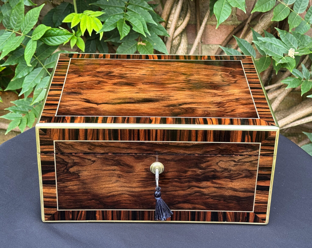 Front view of an Antique Jewellery Box in Calamander, by Edwards.