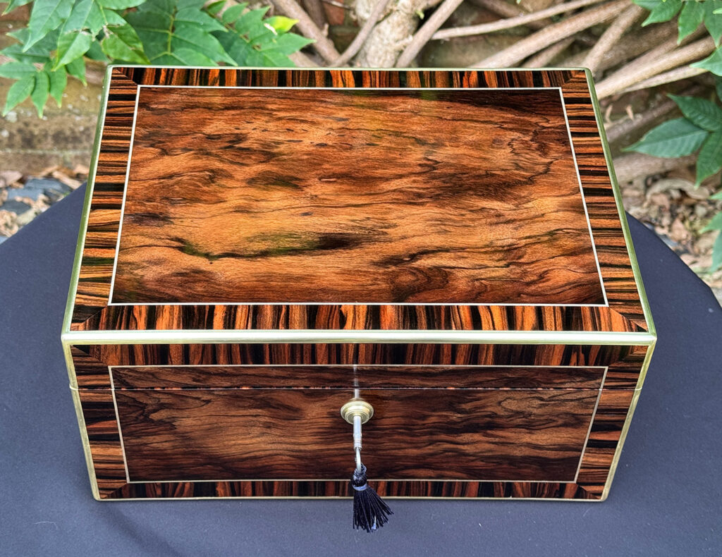 Overhead view of an Antique Jewellery Box in Calamander, by Edwards.