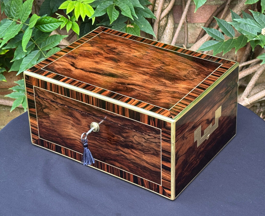 Front right overhead view of an Antique Jewellery Box in Calamander, by Edwards.