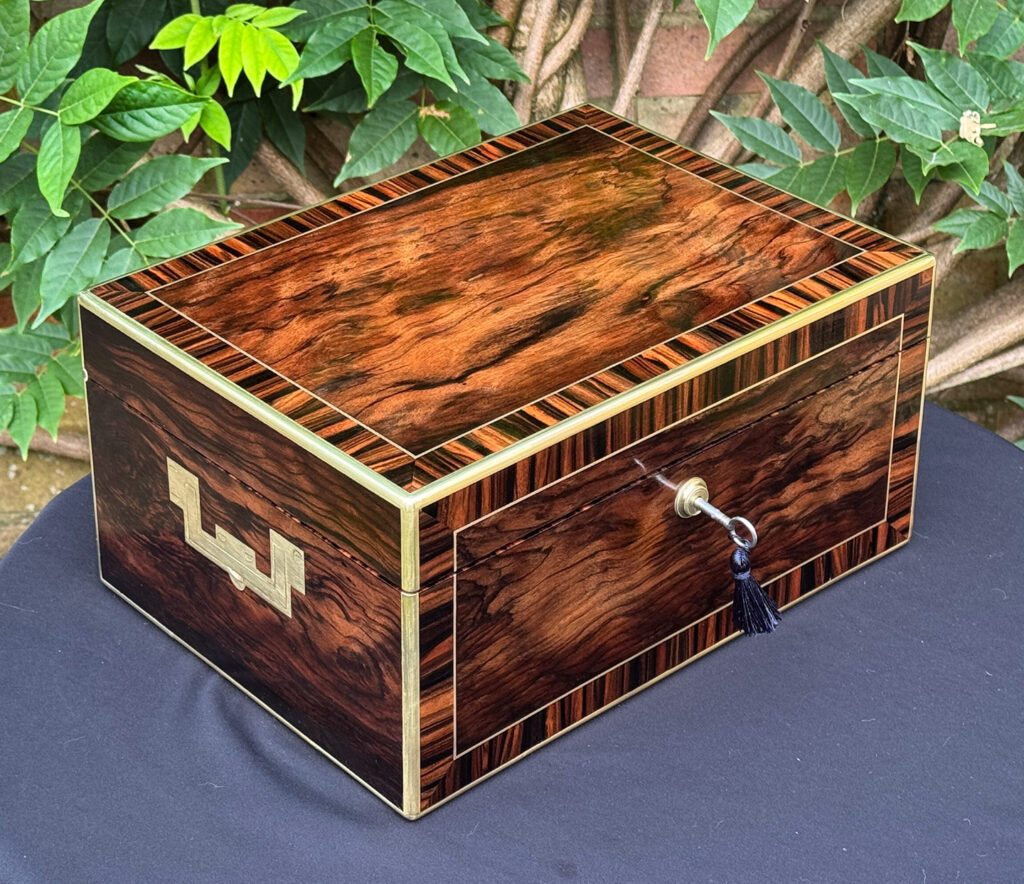 Front left view of an Antique Jewellery Box in Calamander, by Edwards.