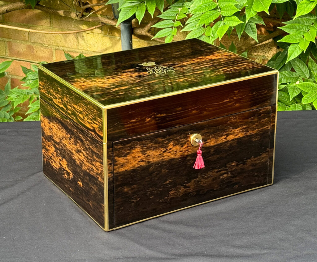Front left view of an Antique Jewellery Box with Secret Internal Travelling Box and Glass Display Area.