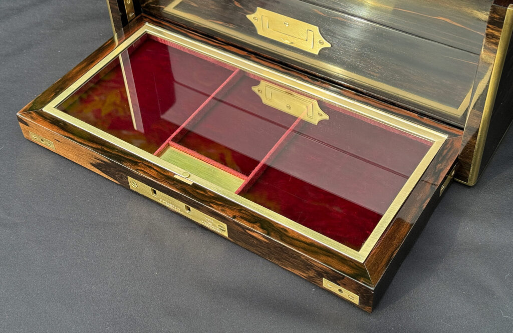 Close up view of the glass hinged lid from an Antique Jewellery Box with Secret Internal Travelling Box and Glass Display Area.