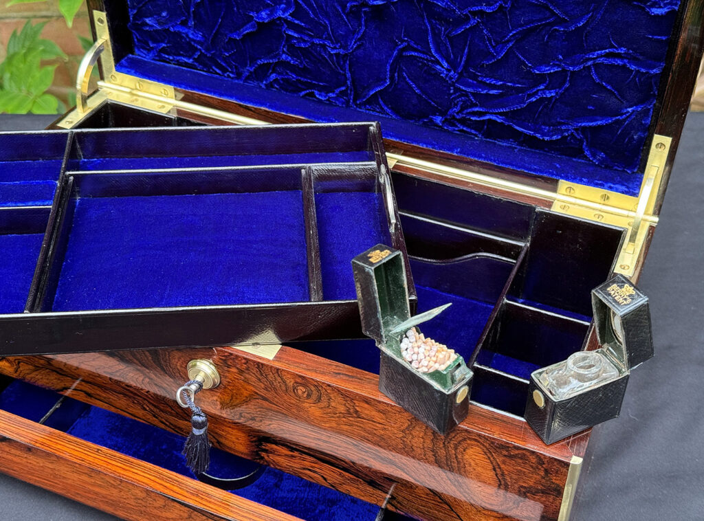 Close up view of interior contents from an Antique Jewellery Box in Rosewood.