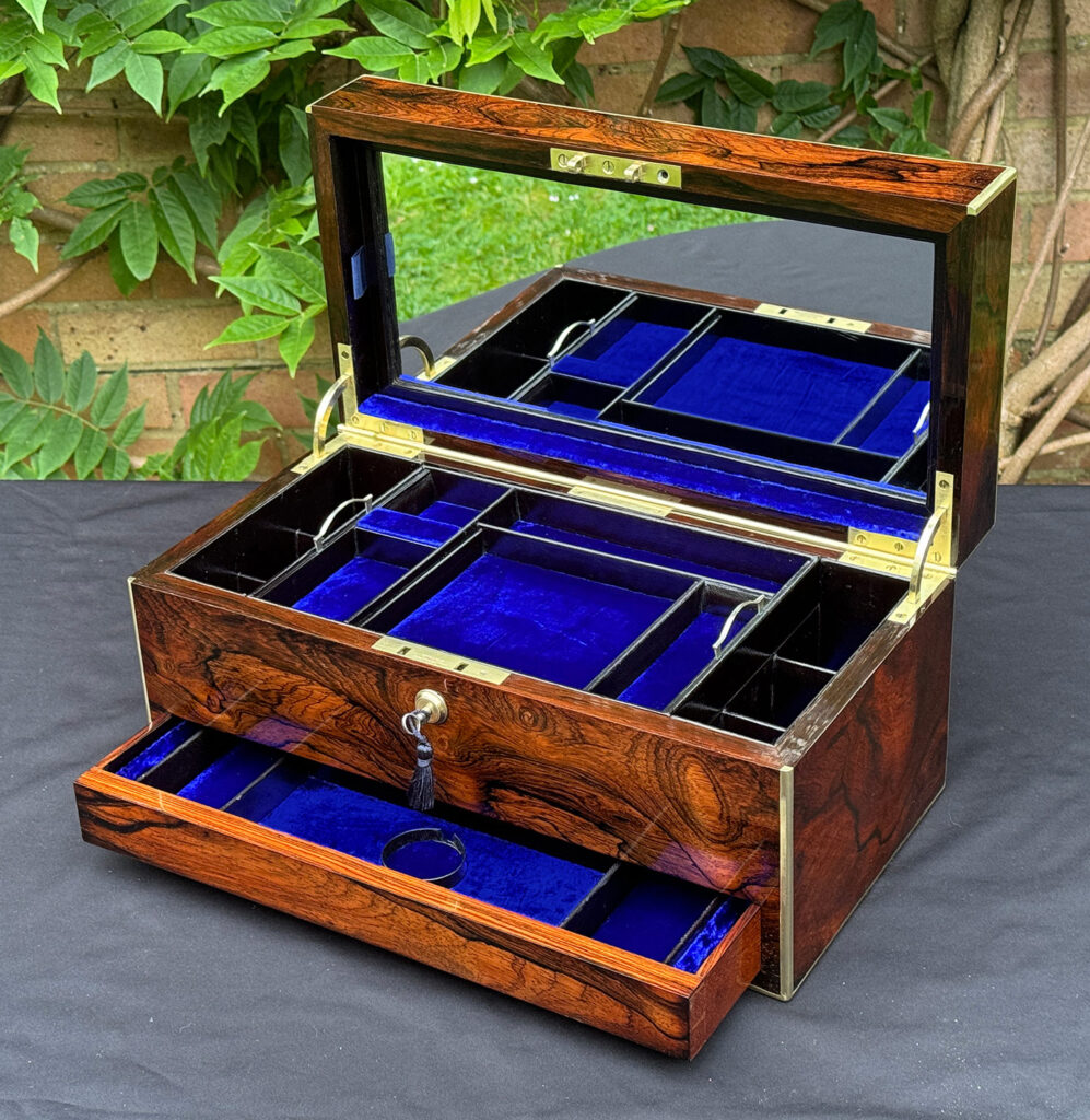 Front right internal view of an Antique Jewellery Box in Rosewood with mirror on display.