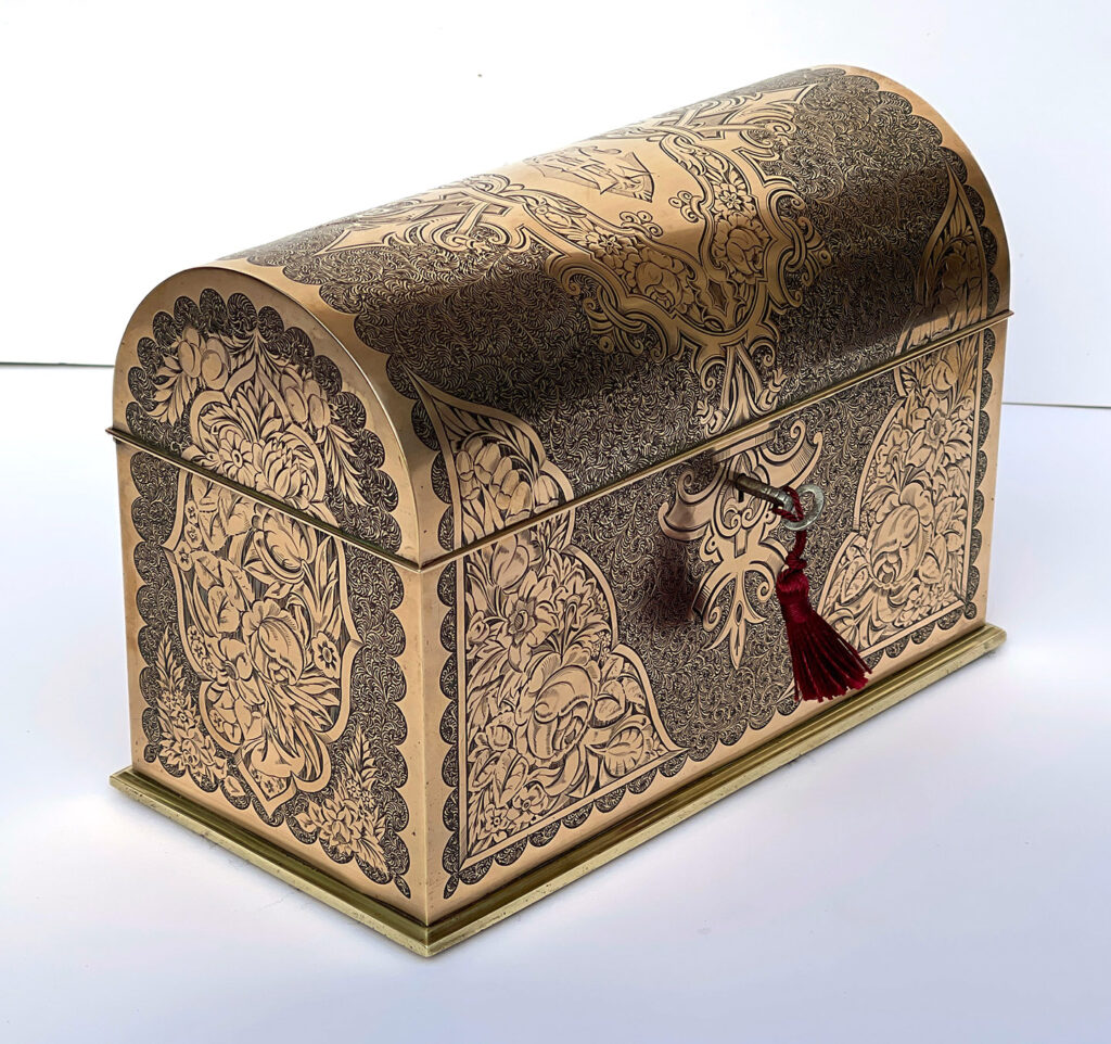 Front left view of an Antique Engraved Brass Jewellery Box, by George Betjemann and Sons.