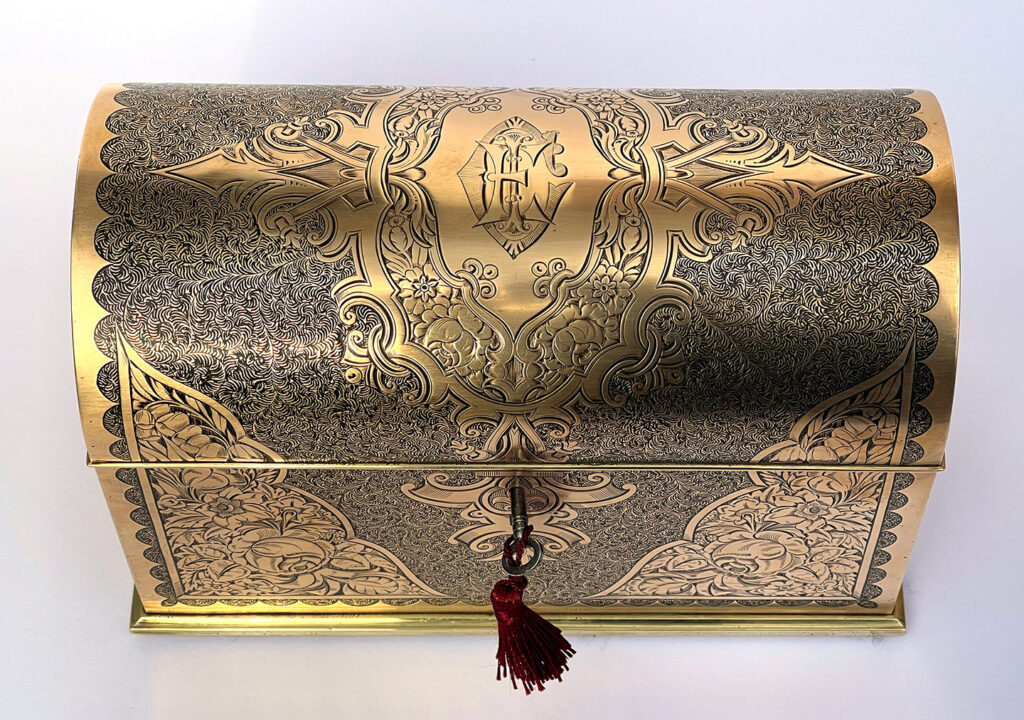Top view of an Antique Engraved Brass Jewellery Box, by George Betjemann and Sons.