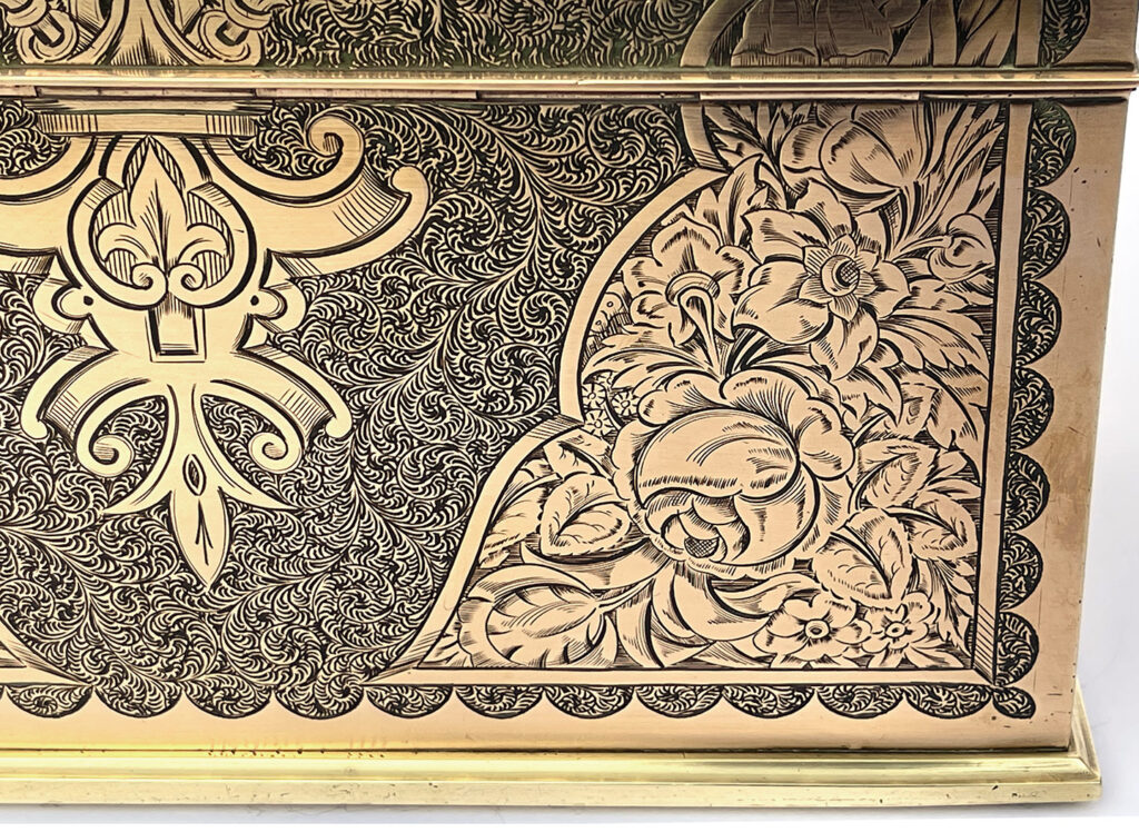 Close up of corner from an Antique Engraved Brass Jewellery Box, by George Betjemann and Sons.