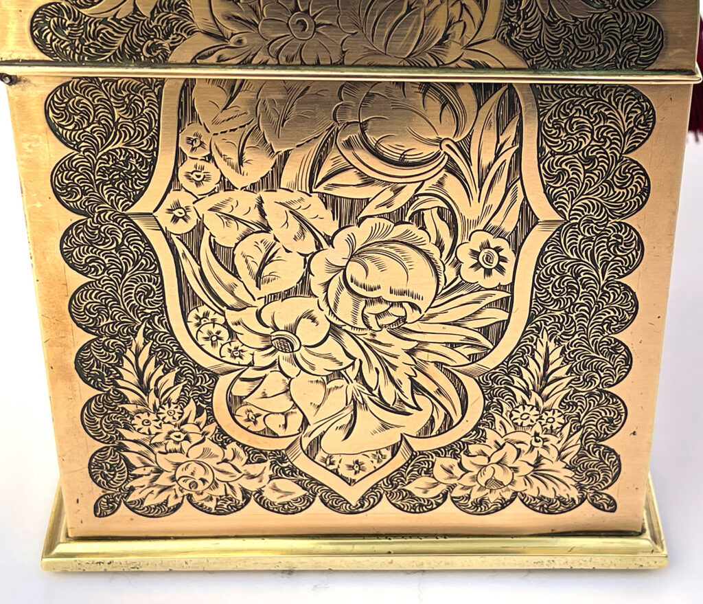 Close up of side from an Antique Engraved Brass Jewellery Box, by George Betjemann and Sons.