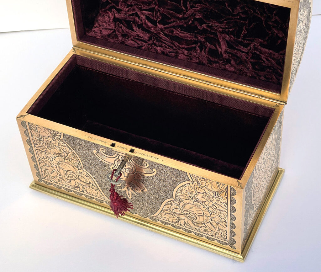 Close up internal view of an Antique Engraved Brass Jewellery Box, by George Betjemann and Sons.