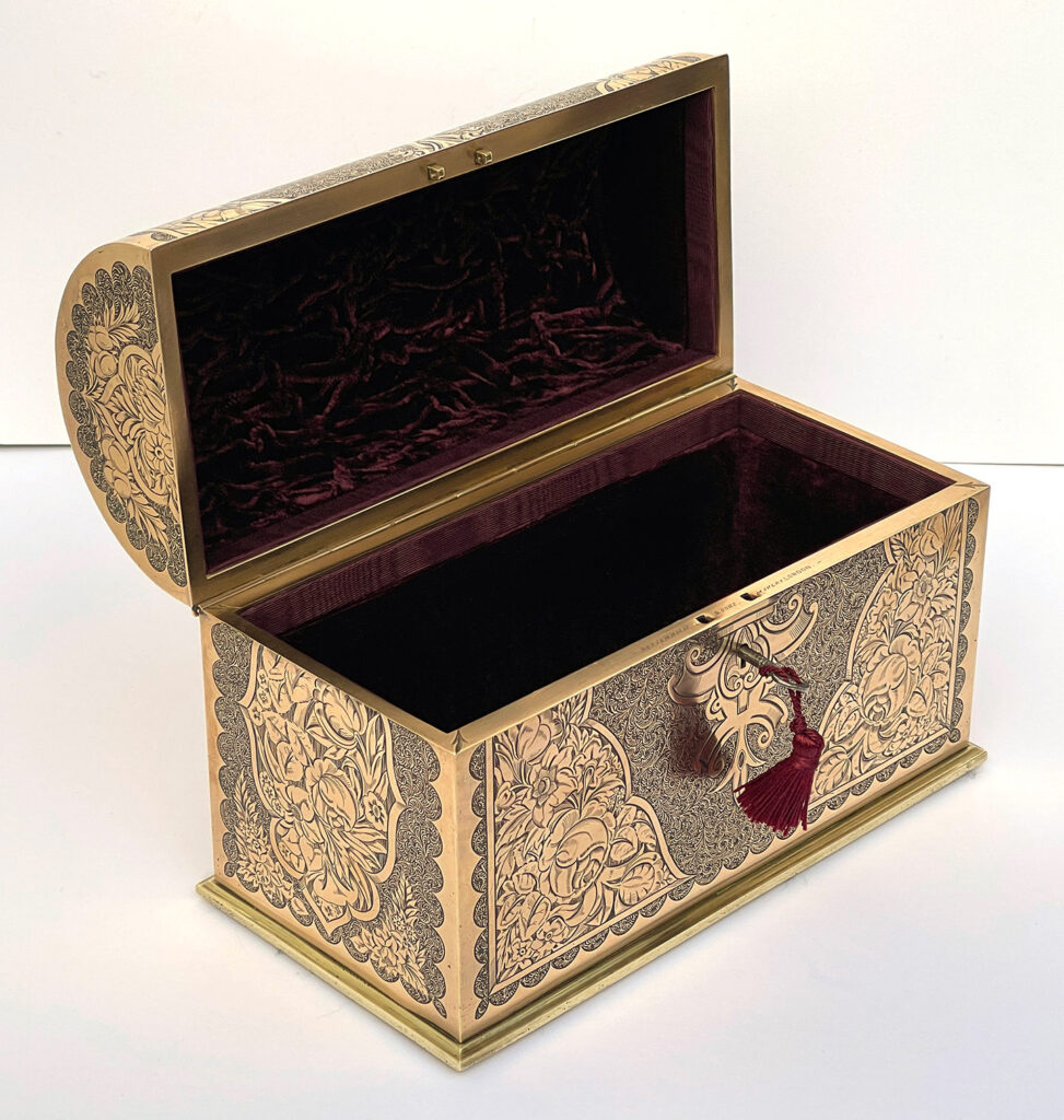Front left internal view of an Antique Engraved Brass Jewellery Box, by George Betjemann and Sons.