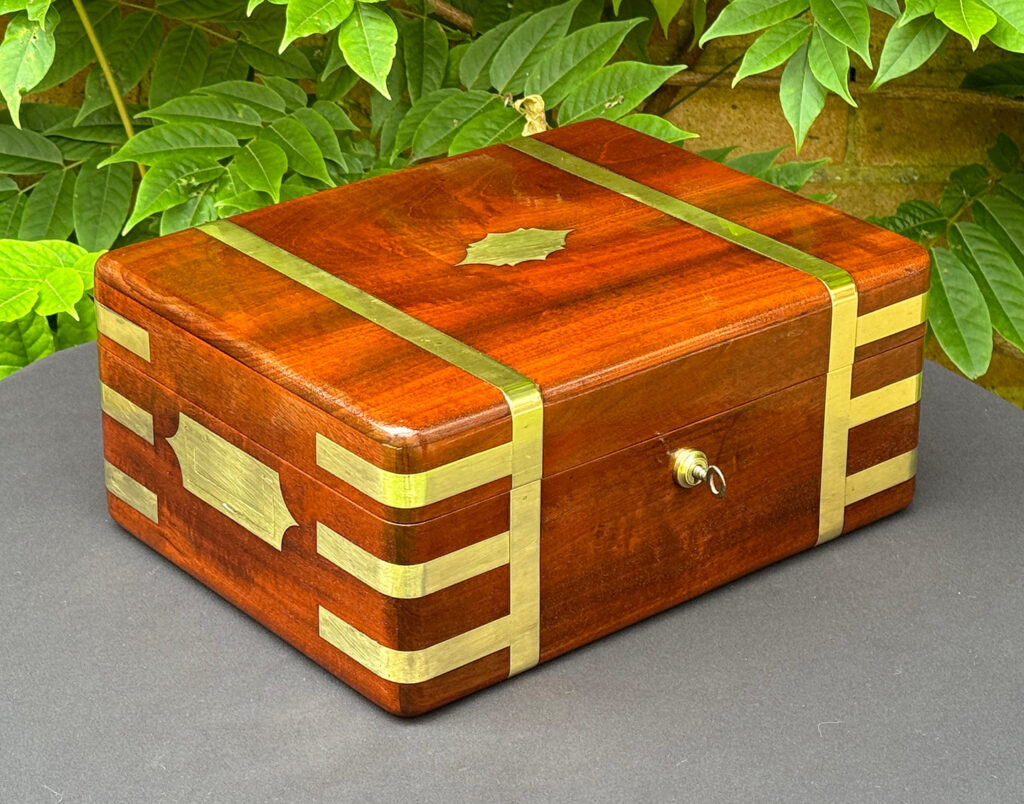 Front left view of an Antique Travelling Jewellery Box in Solid Mahogany.