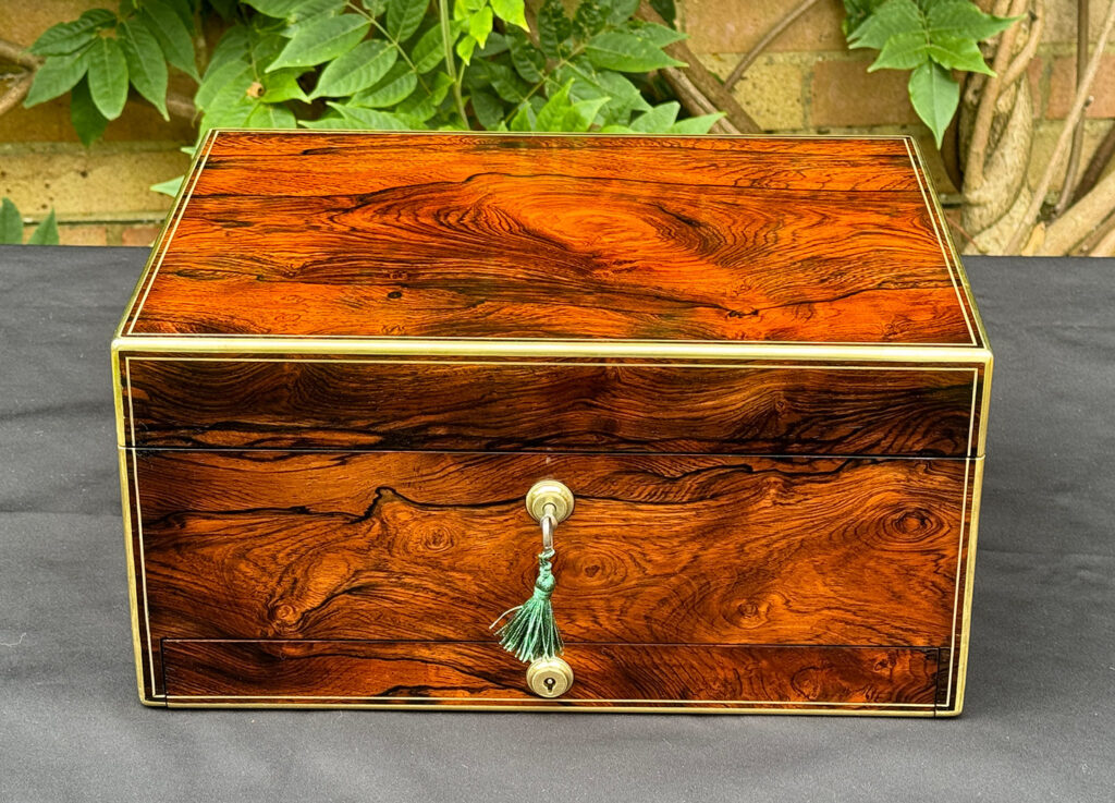 Front view of an Antique Jewellery Box in Rosewood, by Edwards.