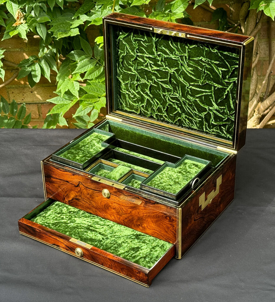 Front right internal view of an Antique Jewellery Box in Rosewood, by Edwards with lower drawer open.
