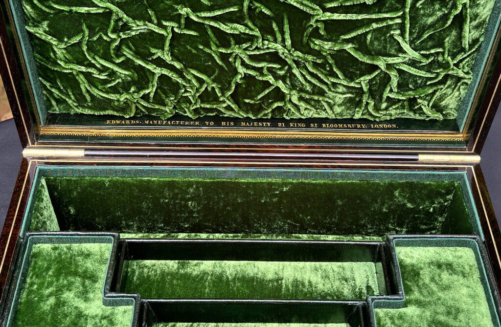 Overhead view of makers mark from an Antique Jewellery Box in Rosewood, by Edwards.