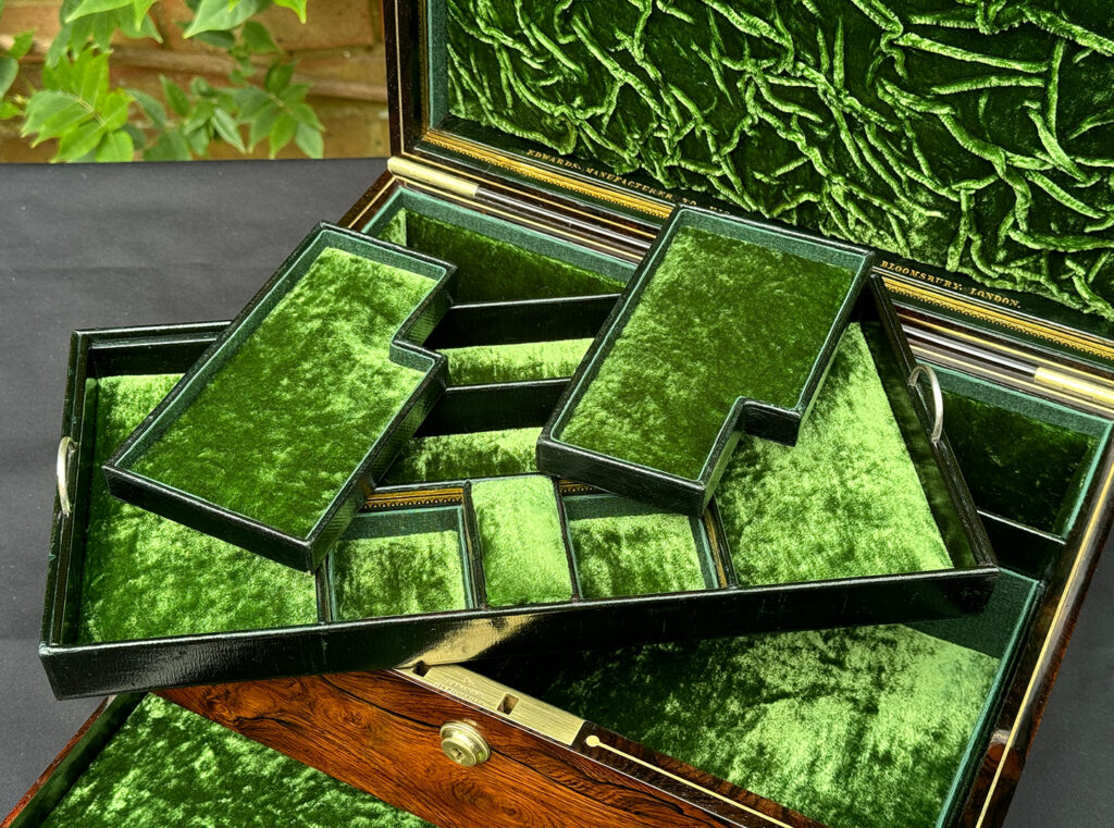 Close up of trays from an Antique Jewellery Box in Rosewood, by Edwards.