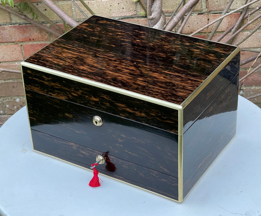 Front right overhead view of an Antique Jewellery Box in Coromandel.
