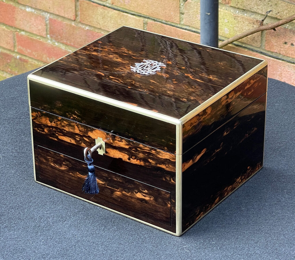 Front right view of a Miniature Antique Dressing Case in Coromandel, by Betjemann and Sons.
