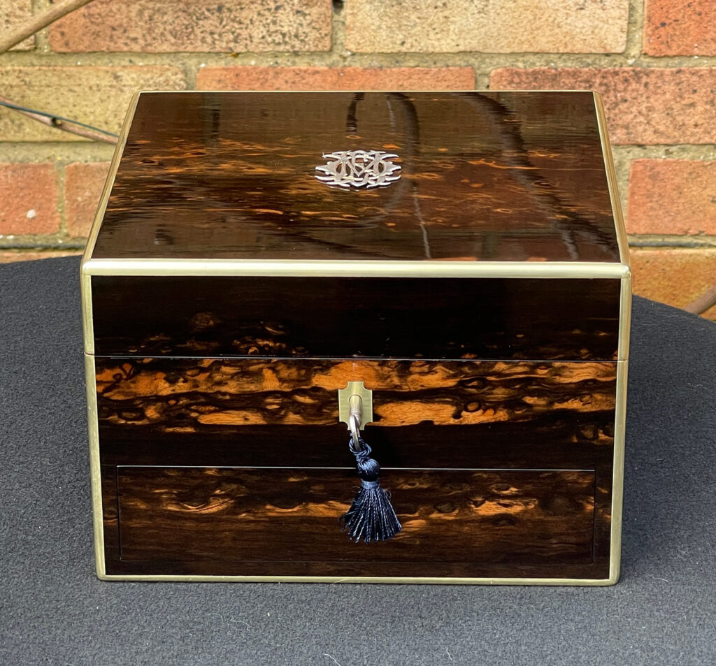Front view of a Miniature Antique Dressing Case in Coromandel, by Betjemann and Sons.
