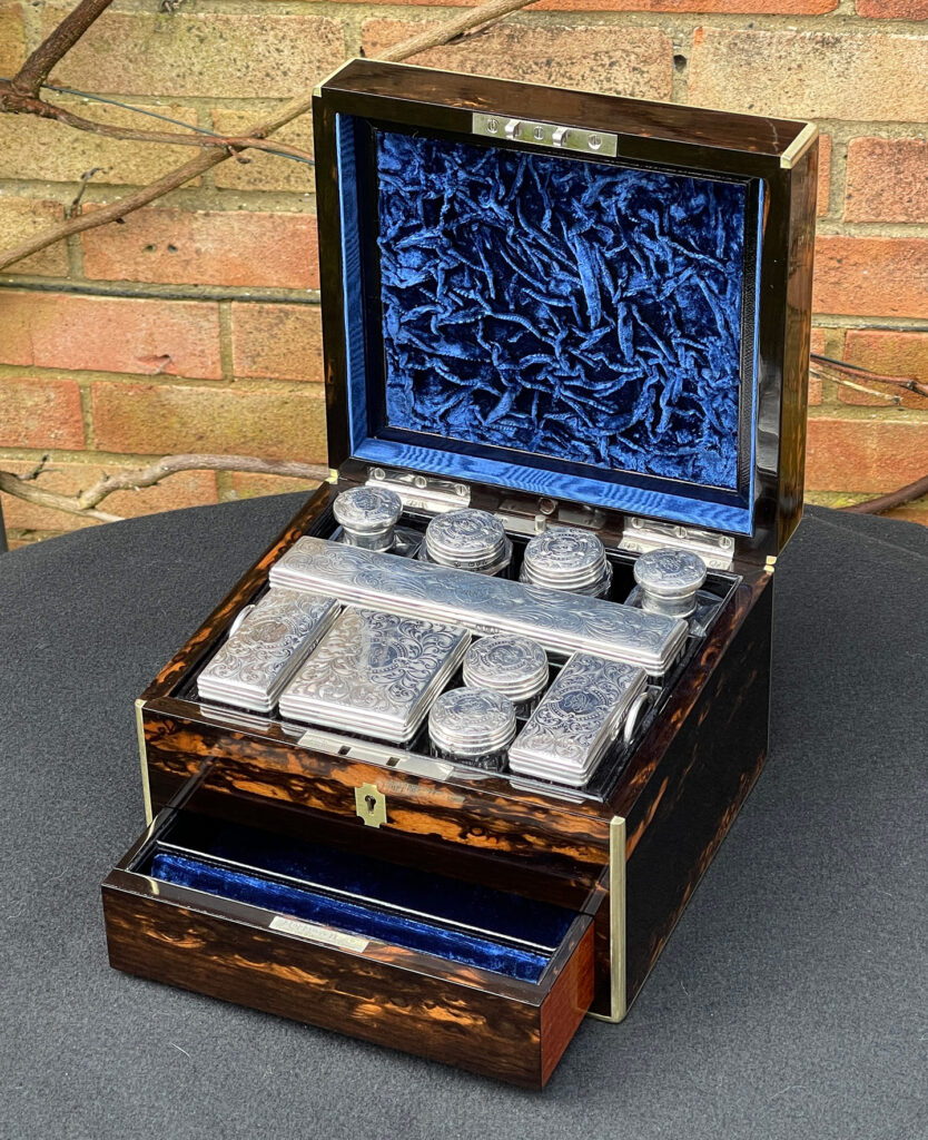 Front right internal view of a Miniature Antique Dressing Case in Coromandel, by Betjemann and Sons.