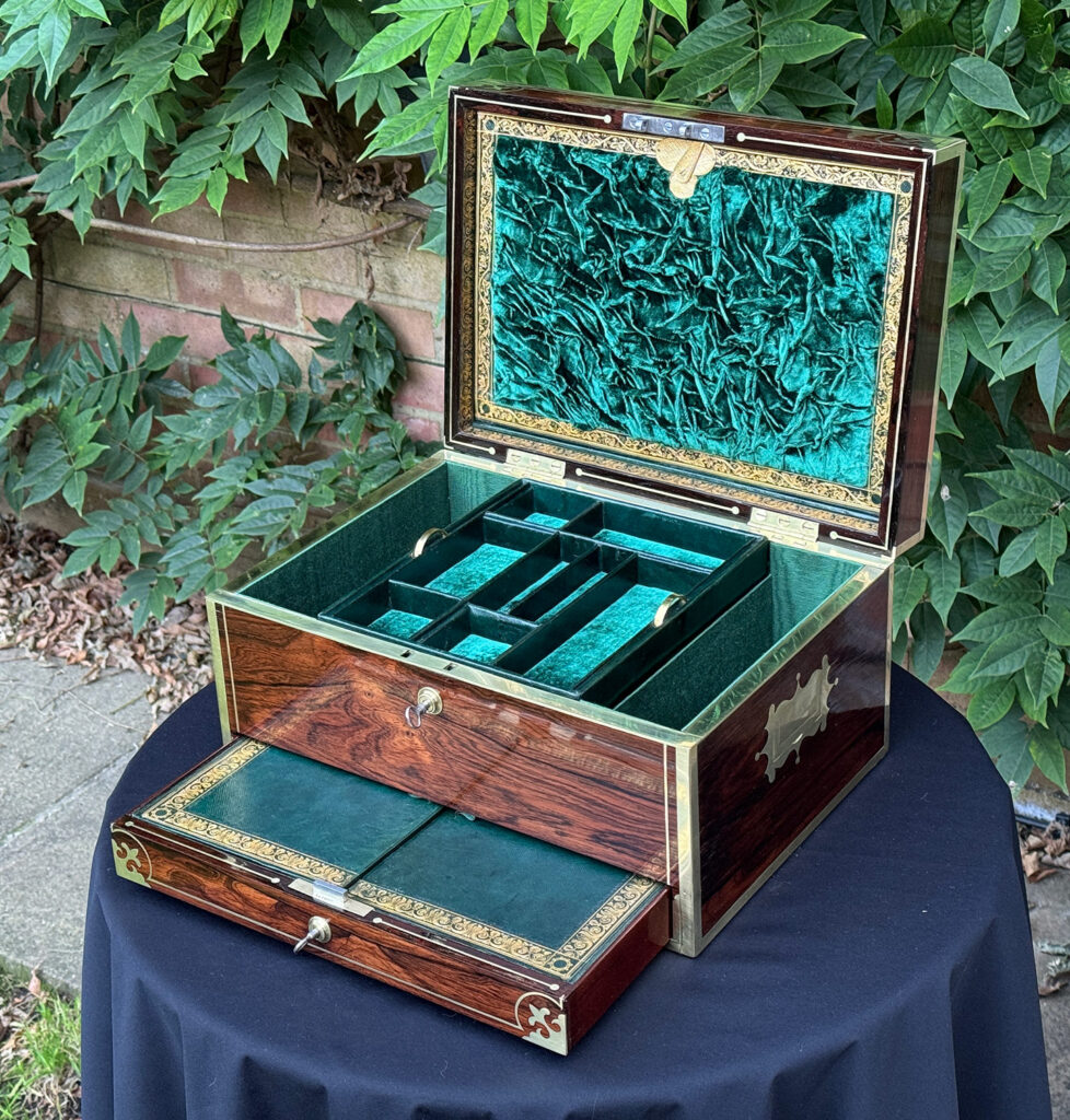 Front right internal view of an Antique Jewellery Box in Rosewood, by Edwards with drawer open.