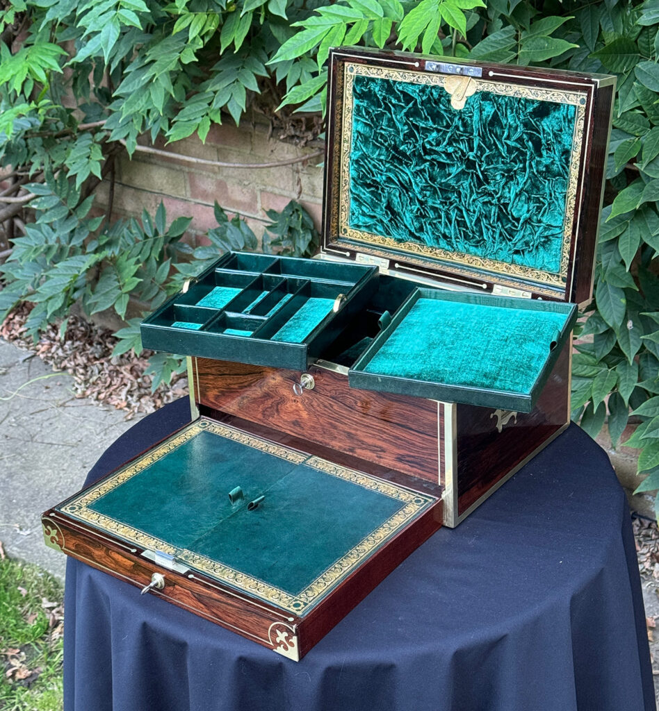 Front internal view of an Antique Jewellery Box in Rosewood, by Edwards with trays removed and drawer open.