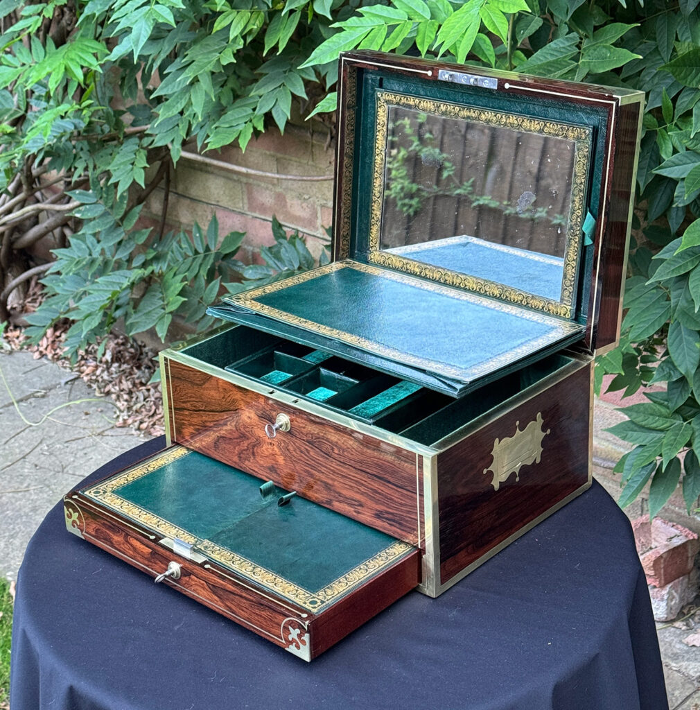 Front right internal view of an Antique Jewellery Box in Rosewood, by Edwards with mirror revealed and drawer open.
