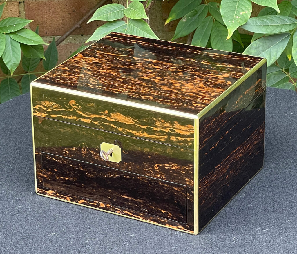 Front right view of a Miniature Antique Gentleman’s Dressing Case in Calamander.