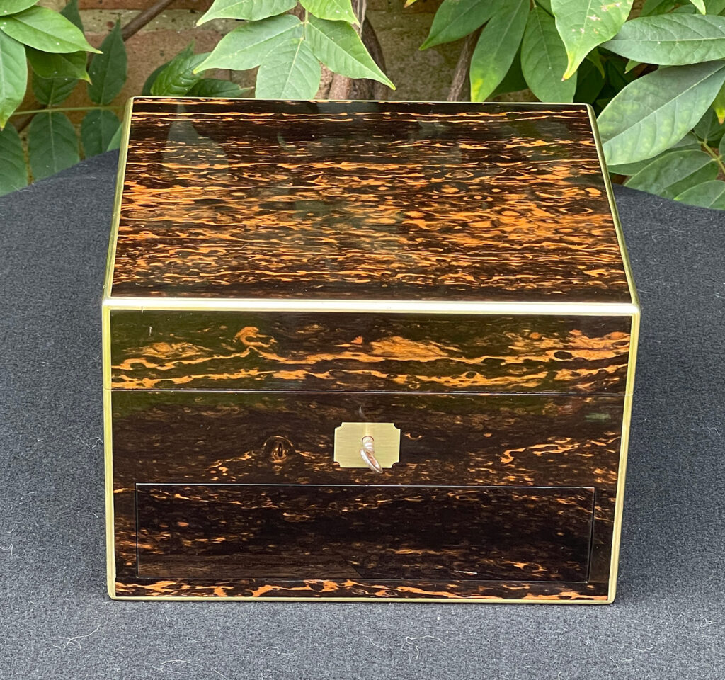 Front view of a Miniature Antique Gentleman’s Dressing Case in Calamander.