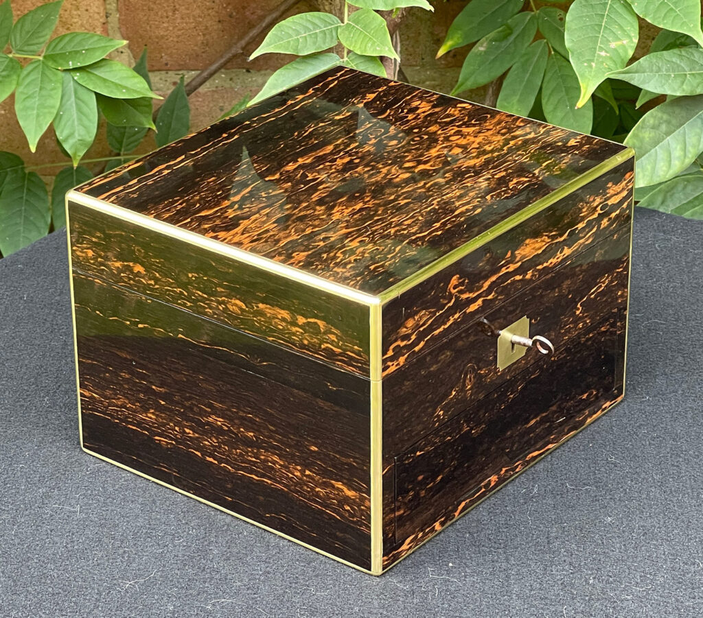 Front left view of a Miniature Antique Gentleman’s Dressing Case in Calamander.