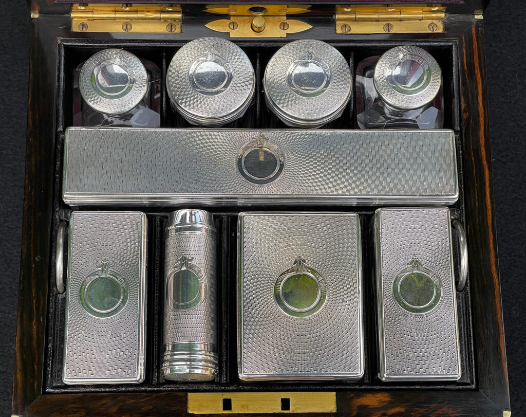 Silver mounted bottles from a Miniature Antique Gentleman’s Dressing Case in Calamander.