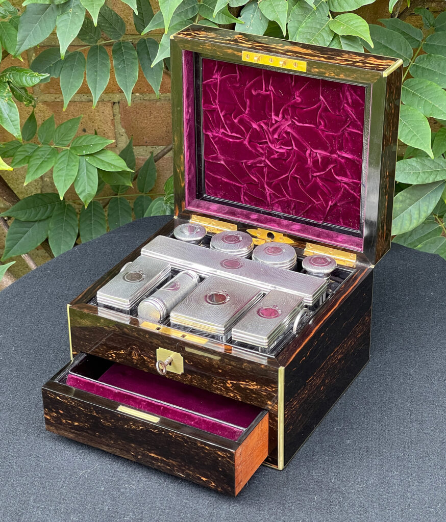 Front right internal view of a Miniature Antique Gentleman’s Dressing Case in Calamander with lower drawer open.