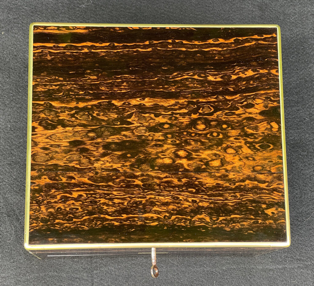 Top view of a Miniature Antique Gentleman’s Dressing Case in Calamander.