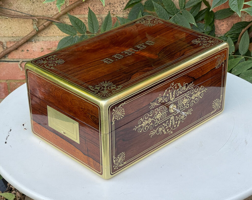 Front left view of a French Antique Jewellery Box in Rosewood with Delicate Brass Inlay, by Aucoc Ainé.