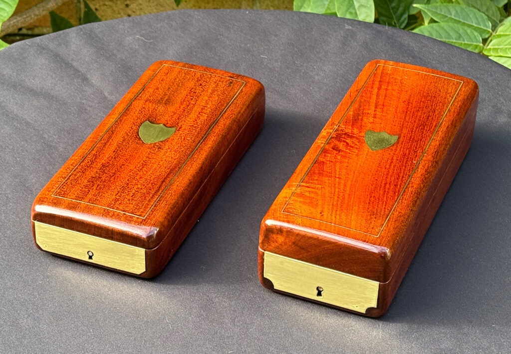 Overhead angled view of a Pair of Small French Antique Solid Mahogany Jewellery Boxes.