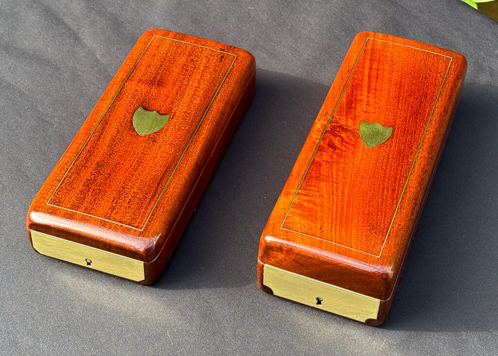 Top angled view of a Pair of Small French Antique Solid Mahogany Jewellery Boxes.