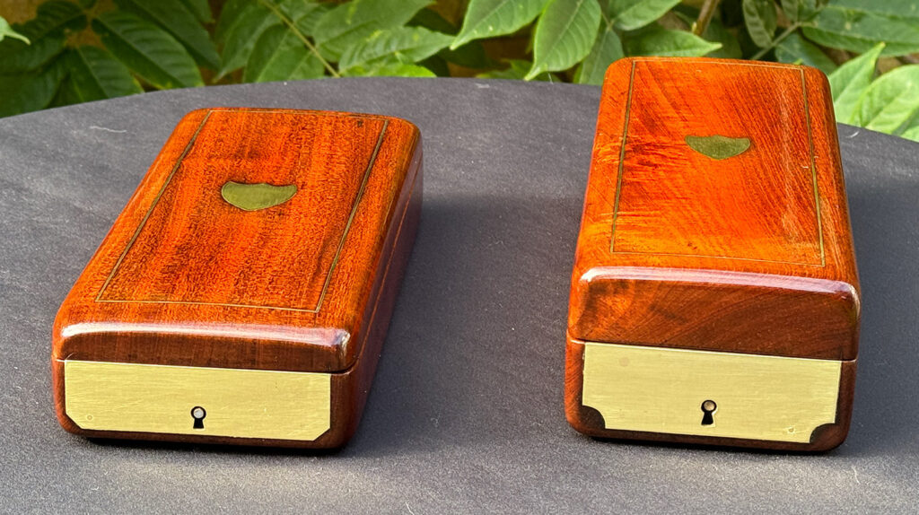 Front angled view of a Pair of Small French Antique Solid Mahogany Jewellery Boxes.