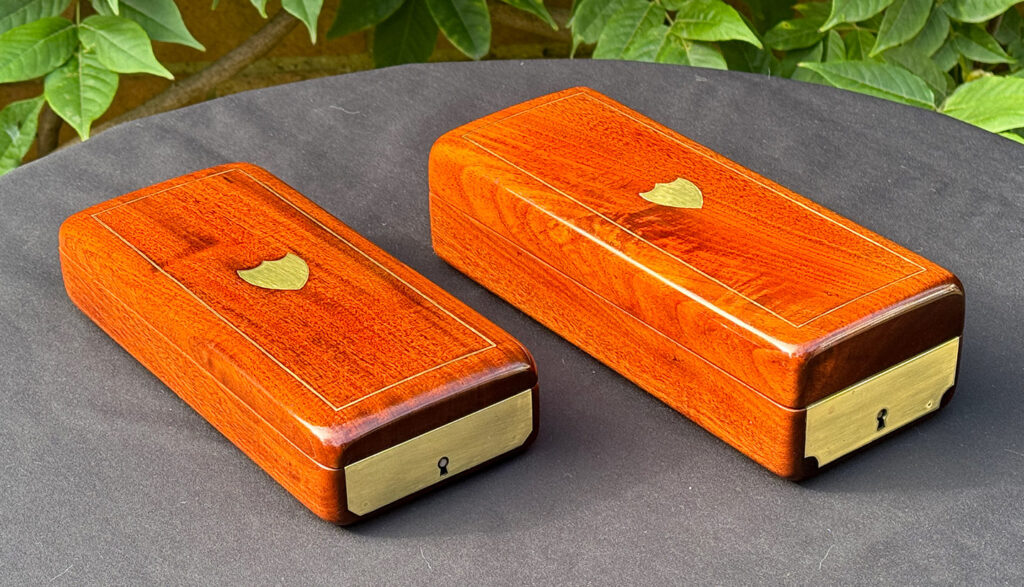 Front left view of a Pair of Small French Antique Solid Mahogany Jewellery Boxes.